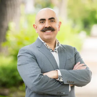 Portrait photograph of Baird & Warner Agent, Giancarlo Olvera