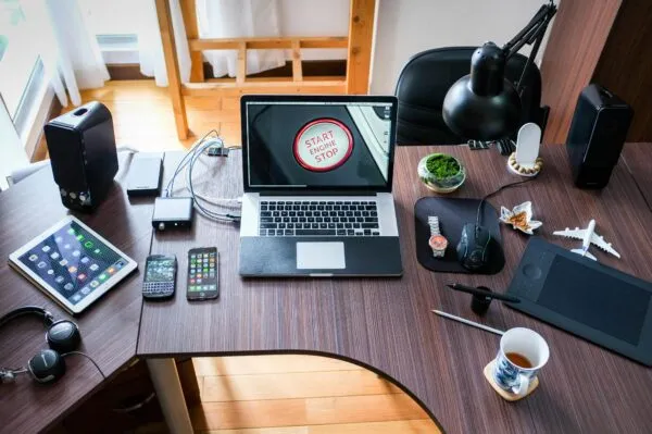 Desk filled with technology and devices